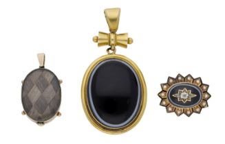 Two mid/late 19th century mourning lockets and a brooch, the first set with a banded onyx ca...