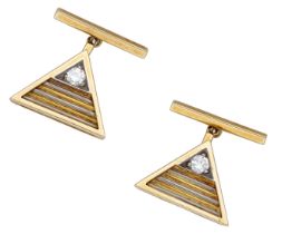 A pair of 18ct gold and diamond cufflinks, 1980, the bicolour triangular panels with reeded...