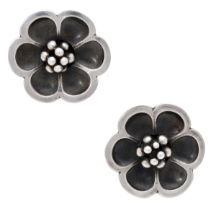 A pair of Danish silver ear studs by Georg Jensen, each realistically modelled as a flowerhe...