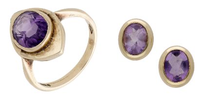 A 9ct gold amethyst ring and earring suite, the lozenge-shaped ring collet-set with an oval-...