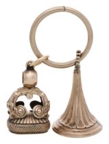 Two 19th century carnelian inset fob seals, the first of flared form, with fluted decoration...