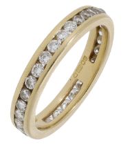 An 18ct gold and diamond eternity ring, channel-set throughout with brilliant-cut diamonds,...