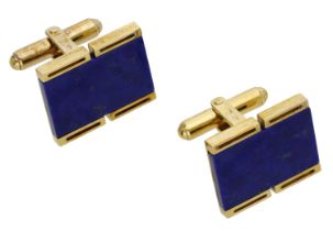 A pair of lapis lazuli cufflinks, the rectangular-shaped lapis lazuli plaques set within...