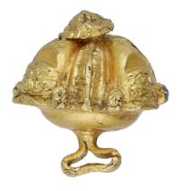 A 16th century Elizabethan gold button, of hollow cast domed form, the front richly...
