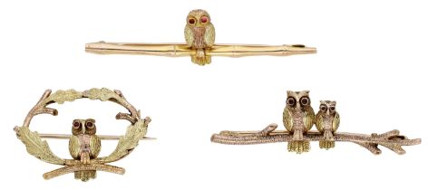 Three owl brooches, the first, modelled as an owl within a circlet of oak leaves, the...