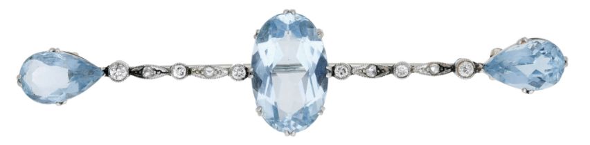An early 20th century aquamarine and diamond bar brooch, the three vari-cut aquamarines...