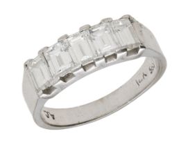 A diamond five stone ring, set with a row of baguette-cut diamonds to a plain polished...