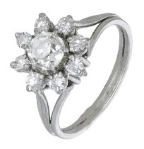 A diamond flowerhead cluster ring, French, set with old brilliant and brilliant-cut...