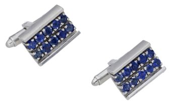 A pair of sapphire cufflinks, the rectangular panels set throughout with circular-cut...