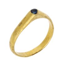 A Medieval late 13th century gold and sapphire stirrup ring, the hoop of D-shaped cross...