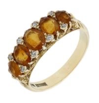 A citrine five stone ring, the graduated row of mixed-cut citrines with diamond highlights...