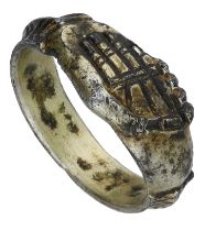 A 15th century silver-gilt Fede finger ring, the bezel comprising a rectangular-shaped...