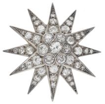 A diamond star brooch, set throughout with old brilliant and single-cut diamonds, total...