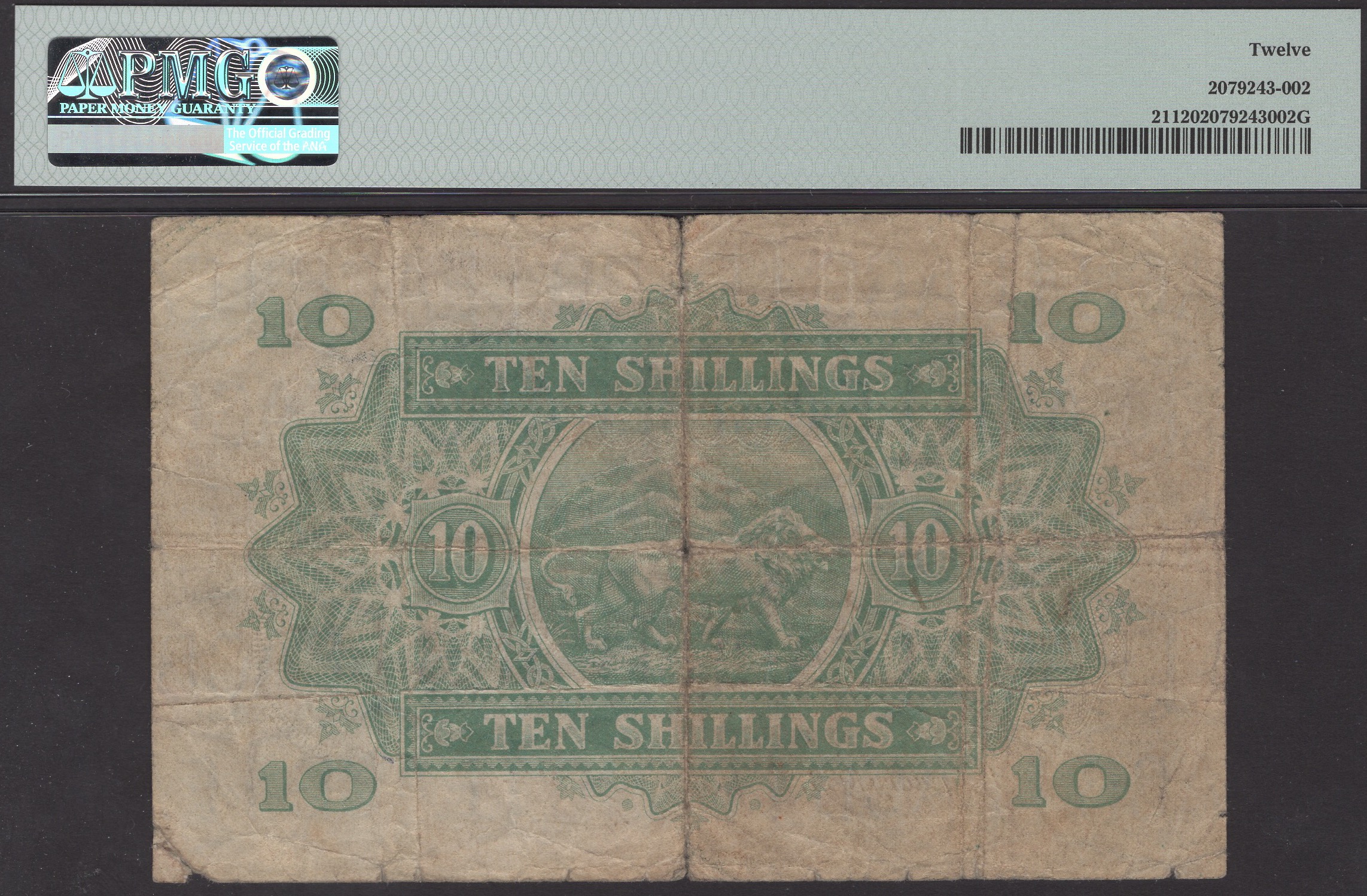 East African Currency Board, 10 Shillings, 1 January 1933, serial number F/8 89460, in PMG... - Image 2 of 2