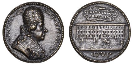 PAPAL STATES, Clement XI, 1704, a cast bronze medal by G. Hamerani, bust right, rev. view of...