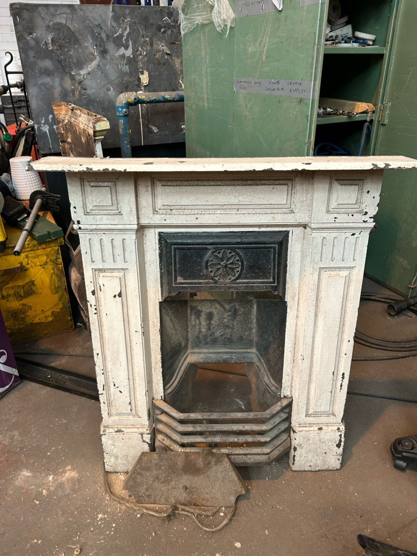 Old vintage cast iron fireplace. Been painted white good condition all parts present