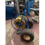Approximately 50m of thick non kink hose on trolly reel.