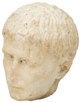 A SMALL ROMAN STYLE MARBLE HEAD OF A MALE. Possibly The Young Augustus Caesar, degraded and with a