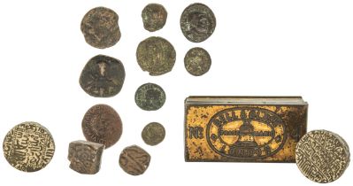 AN INDO-PERSIAN DIE OR SEAL, ANOTHER, TWO INDIAN BRONZE COINS and assorted Roman Bronze coins.