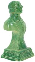 A GREEN GLAZED POTTERY BUST LATE 18TH CENTURY Depicting a bewigged gentleman, raised on a socle,
