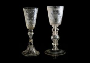 TWO LARGE EUROPEAN GLASSES 18TH CENTURY Engraved to suggest rock crystal, both with early repairs,