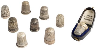A COLLECTION OF SILVER THIMBLES, C.1900 Eight hallmarked thimbles of various designs and one in a