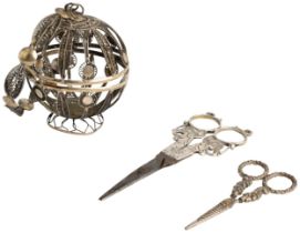 A SILVER FILIGREE YARN BALL WITH BRACELET, GERMAN? C.1860 Together with a pair of silver mounted