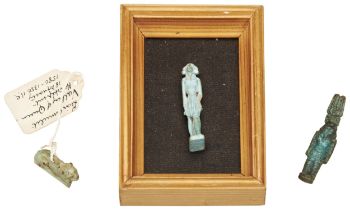 A FAIENCE AMULET OF KHNUM STANDING, And a faience amulet of a lion both with old labels, one the