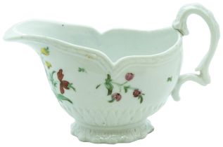 A BRISTOL PORCELAIN SAUCE BOAT CIRCA 1770 The moulded body painted with floral sprigs, blue 'X' mark