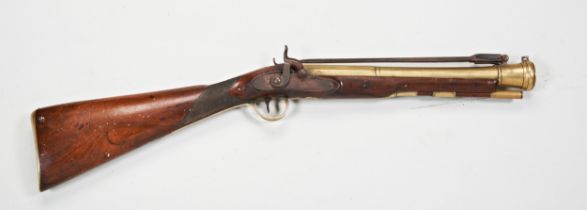 A 19TH CENTURY CONVERTED PERCUSSION COACHING BLUNDERBUSS with flick-over bayonet, The brass barrel