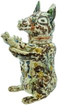 A PEARLWARE BEAR JUG CIRCA 1800 Decorated in Pratt type colours, the muzzeld bear holding a hound.