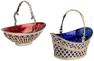 A SILVER-GILT SWING HANDLE BASKET WITH BLUE LINER, SHEFFIELD 1900 Together with another basket