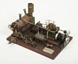 A LIVE STEAM STATIONARY ENGINE, probably kit built with additions, mounted on a champfered wooden