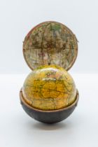 A NEWTONS NEW AND IMPROVED TERRESTRIAL GLOBE, published Jan 1st 1817, in a spherical fish skin case,