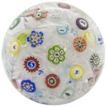 A BACCARAT PAPERWEIGHT, DATED 1848 With tumbled muslin ground and various animal canes, 7.5cms