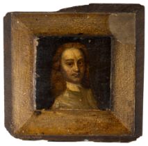 A NAIVE 17TH CENTURY PORTRAIT OF A GENTLEMAN, on a small shaped wooden panel, probably from a