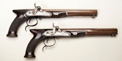 W. PARKER; A PAIR OF SAW HANDLED PERCUSSION SPORTING PISTOLS WITH OCTAGONAL DAMASCUS BARRELS, ‘gold’