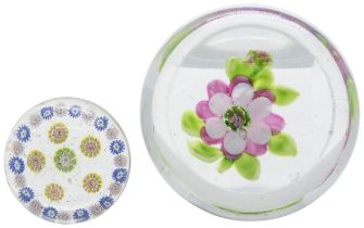 A FLOWER PAPERWEIGHT AND A SMALL MILLEFIORE WEIGHT Late 19th century, largest is 8cms