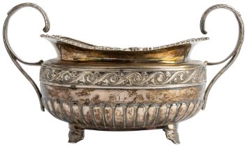 A HALF FLUTED GEORGE IV OBLONG SUGAR BOWL, DUBLIN 1822 With cast rim and chased floral band. 21