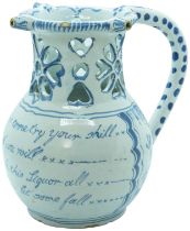 AN ENGLISH DELFT PUZZLE JUG CIRCA 1750 Of typical form with underglaze landscape decoration and