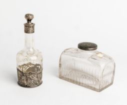 A SILVER MOUNTED DECANTER, C.1880 Together with another oblong travel decanter 21 cm.