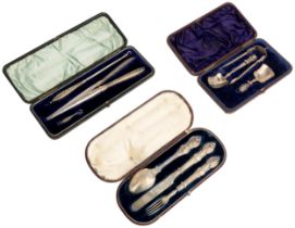 A CASED CHRISTENING SET, SHEFFIELD 1869 Together with a cased pair of button hooks and a glove