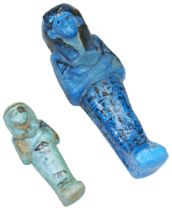 AN ANCIENT EGYPTAIN BLUE FAIENCE USHABTI FIGURE. With painted heiroglyphs and another. 15cms max