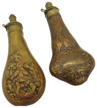 A VICTORIAN BRASS GUN POWDER FLASK pressed with a lily leaf decoration and another brass powder