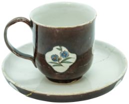 A STAFFORDSHIRE 'BATAVIAN WARE' CUP AND SAUCER CIRCA 1750-60 The cup of slight bell shape glazed