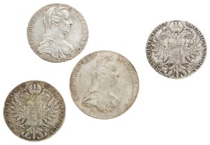 A MARIA THERESA THALER, two others and an outsize re-strike Thaler.