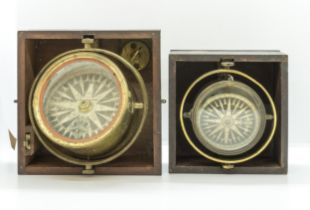 A VICTORIAN GIMBEL MOUNTED BRASS MARINE COMPASS with sighting slots, in a wooden transit case and