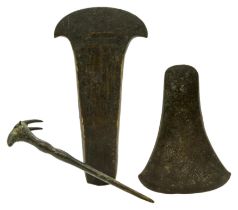 A BRONZE AGE FLANGED AXE HEAD with incised decoration and a plain flat Bronze Age Axe head and a