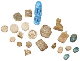 AN EGYPTIAN SCARAB. Five others, two amulet beads, an assortment of terracotta seals and a faience