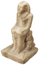 A CARVED MARBLE FIGURE OF A SEATED PHAROAH AFTER THE ANTIQUE, flanked by two seated lions and with a